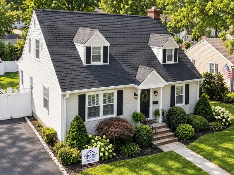 Aerial view of a completed Rylee Ann Roofing installation with clean gutters on a Cape Cod home in Edgewater Park, NJ