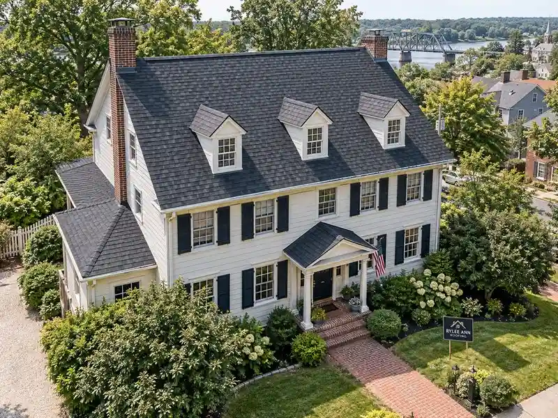 Rylee Ann Roofing residential roof replacement with new asphalt shingles on a traditional home.